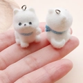 Macro shot of white flocked Pomeranian dog charms with blue collars for DIY jewelry making - Blue Scarf Friendly Dog (24801) / 29x19x27mm
