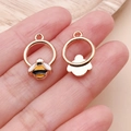 Macro detail of miniature yellow enamel bee charm showing front and back texture - Yellow Enamel Insect Round Bee (25147)