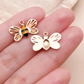 Macro detail of bee pendant showing yellow enamel front and smooth metal back texture - Yellow Enamel Insect Hollow Wing Bee (25146)