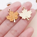 Golden maple leaf charms with orange enamel detail for DIY jewelry making - Yellow Drip Oil Maple Leaf Charm (25055) / 23x19x2mm