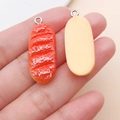 Simulated red bread food charm pendant for DIY keychain and phone chain accessories - White Cream Long Bread (17083)