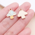 Blue and yellow drip oil mushroom pendant charm shown on finger for scale size - 14x16mm Lake Blue Enamel Zinc Alloy Mushroom (14978)