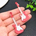 Macro detail of red acrylic electric guitar pendants for DIY keychain accessories - Red (24059)