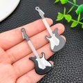 Macro view of black and white acrylic guitar pendants for DIY keychain and accessory making - Black (24056)