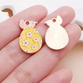 Yellow Easter egg bunny pendant with white floral enamel and golden alloy back for DIY jewelry - Yellow Easter Flower Bunny Egg (25133)