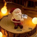 Miniature resin Santa Claus figurine with gift box, festive Christmas decor, 4.5cm height - Santa Claus with Sack (No. 5)