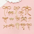 Set of 14 gold plated bow pendants with crystal and lace details for DIY jewelry making - Bowknot Series Set 15 Styles (SN1055)