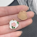 Detailed view of pink rose enamel charm with white cloud border and leaf details - White Enamel Zinc Alloy Rose Plaque Charm (21123)