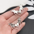 Close-up of gothic silver bat wing and heart pendants for DIY jewelry making - Antique Silver Cross Bat Wings (18640)