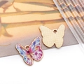 Close-up of butterfly pendant showing colorful enamel front and gold textured back - Printed Flower Butterfly Style (19059)