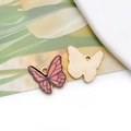 Detailed macro view of pink butterfly alloy pendant with enamel finish and golden back - 19058 Pink Black Pattern Butterfly
