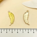 Detail view showing front yellow enamel and back golden texture of feather charms - Yellow Feather Pendant (21821)