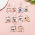 Macro shot of assorted miniature resin goldfish bag charms with colorful tropical fish - Tropical Fish Variety Pack (SN1069)