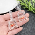 Detail view of creative resin goldfish in water bag charm with metallic ring hook - Orange Simulation Fish Bag Earring (21519) / 52x24mm