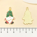 Macro shot of Christmas gnome pendant showing colorful enamel front and textured gold back - Christmas Gnome (21713) / 30x18mm
