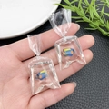 Macro shot of creative resin goldfish in water bag earrings showing texture and detail - Blue Tricolor Fish Earring (21517) / 52x24mm