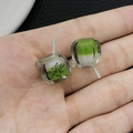 Detailed macro of a green and white resin mini coffee cup pendant with a hanging ring - Green Luminous Cup (18979)