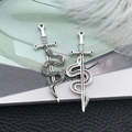 Detailed antique silver snake and sword charms on leather background for jewelry DIY - Antique Silver Snake and Sword (18771)