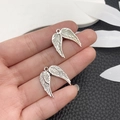 Silver punk wing pendant in hand with detailed feather texture for DIY necklaces - Antique Silver Feather Wing (10053)