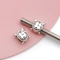 Macro shot of vintage silver alarm clock beads on a snake chain showing antique textures - Antique Silver Round Alarm Clock Bead (15667)