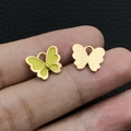 Macro detail of butterfly charm with yellow enamel finish and golden brushed metal back - Yellow Enamel Butterfly (12495)