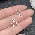 Bright silver hollow star pendants held on fingertips for DIY jewelry making size scale - Antique Silver Small Five-Pointed Star 10x12mm (6915)