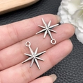 Pair of vintage silver star pendants for DIY jewelry making held by hand - Antique Silver Eight-Pointed Star 23x20mm (21508)