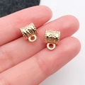 Detailed macro of vintage KC gold barrel beads with floral engraving for DIY jewelry - Bail 11x8mm (20656) / Hole 5mm