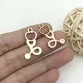 Golden stethoscope charms with white enamel and striped textures for DIY medical jewelry - White Medical Stethoscope