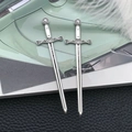 Pair of antique silver sword pendants with intricate hilt details and lion crest emblem - Antique Silver Sword (8075)