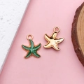 Dettaglio di ciondoli a stella marina in smalto verde dorato per creazione gioielli fai da te - Ciondolo Stella Marina (8611)
