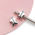 Close-up of silver gingerbread man charms for DIY bracelets showing detailed engraving - Antique Silver Christmas Snowman Bead (15676)
