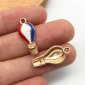 Macro shot of hot air balloon charm with red white blue enamel and gold plating - KC Gold Enamel USA Flag Hot Air Balloon Style (16282)
