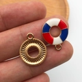 Close-up of nautical lifebuoy and gold gear pendants for DIY jewelry making - KC Gold Enamel Round USA Flag Lifebuoy Style (16277)
