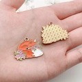 Detail of colorful fox alloy pendant charms for DIY jewelry making on a palm - Red Brown Flower Fox