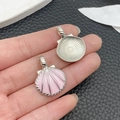 Pink and silver shell charms held in palm showing size detail and enamel finish - Pink Glitter Enamel Large Shell (21914)