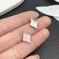 Pink enamel and silver rhombic charms for DIY jewelry making held between fingers - Pink Enamel Rhombus Block (21919)