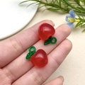 Close-up of red acrylic apple charms with green leaves for DIY jewelry making - Red Apple (22169)