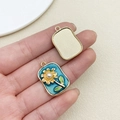 Detailed close-up of rectangular sunflower enamel pendant with pearl core and gold backing - Dark Blue Square Monet Garden Sunflower Leaf (22113)