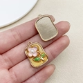 Detail of sunflower pendant with pink enamel petals and pearl center on gold alloy base - Yellow Square Monet Garden Pearl Flower Leaf (22112)