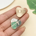 Detailed view of handmade enamel windmill pendant charm with polished gold texture back - Rope Triangle Zongzi (22893)