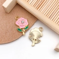 Close-up of pink enamel rose flower charm with sparkling rhinestone and green leaf detail - Pink Enamel Gold Base Rhinestone Rose Style (16691)