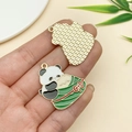 Detailed close-up of a panda and zongzi charm with colorful oil drip finish and gold back - Panda Holding Zongzi (23036)