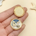 Detail of DIY ocean theme round pendant featuring starfish and shell charms in hand - Blue Cracked Shell Conch (22063)