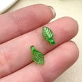 Macro shot of semi-transparent green acrylic leaf pendants for DIY jewelry crafting - Dark Green Mini Leaf (22140)