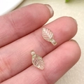 Macro shot of light green acrylic leaf pendants showing translucent veins and details - Light Green Mini Leaf (22139)