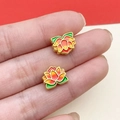 Detailed macro of enamel lotus charm with gold plating and vibrant gradient colors - Matte Gold Lotus Spacer Bead (22471) / 1 Piece/Pack (11x9mm) / Green & Red