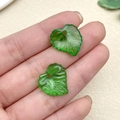 Detailed view of translucent green acrylic leaf pendants with realistic leaf vein texture - Heart Leaf (22155)
