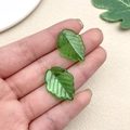 Detail of green acrylic leaf pendants with vein patterns for handmade earring DIY projects - Tea Tree Leaf (22150)