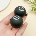 Close-up of black 8-ball sports pendant charm with hanging hole for DIY keychains - Black-White 8-Ball Billiards (23148)